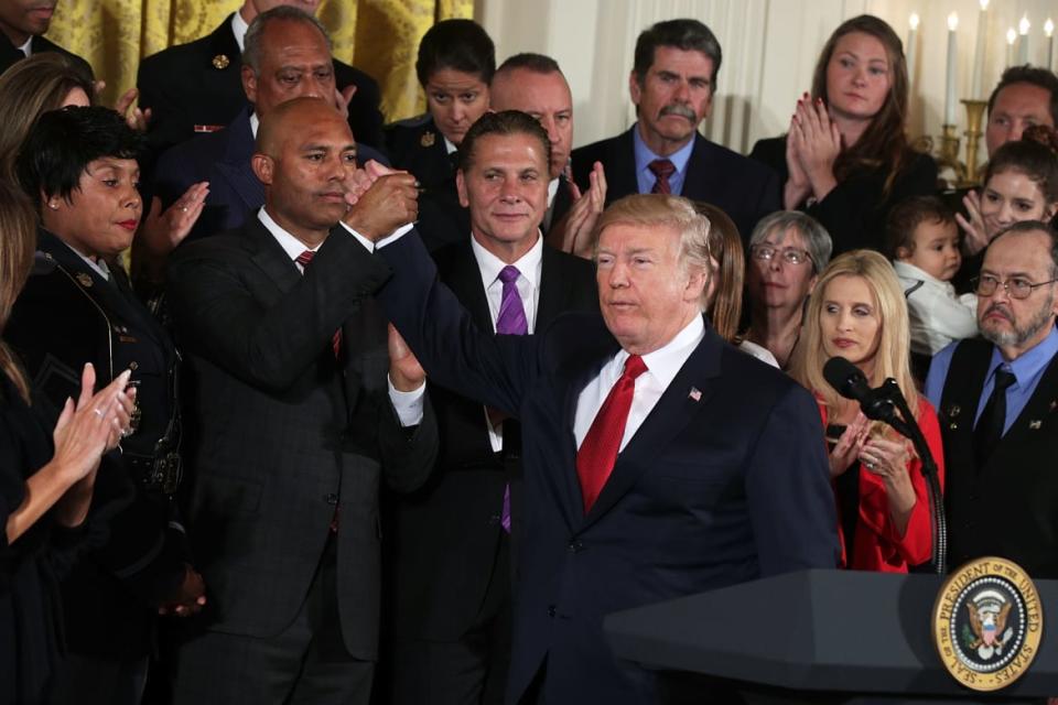<div class="inline-image__caption"><p>President Donald Trump holds hands with Mariano Rivera during an event highlighting the opioid crisis in the U.S. on October 26, 2017, in the East Room of the White House in Washington, D.C. </p></div> <div class="inline-image__credit">Alex Wong/Getty</div>