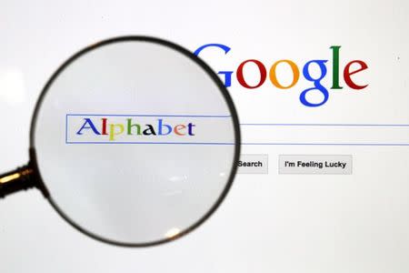 A Google search page is seen through a magnifying glass in this photo illustration taken in Berlin, August 11, 2015. REUTERS/Pawel Kopczynski/File Photo