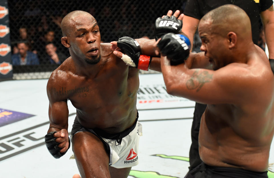 Jon Jones punches Daniel Cormier in their UFC light heavyweight championship bout during the UFC 214 event at Honda Center on July 29, 2017 in Anaheim, California. (Getty Images)