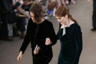 US actresses Julianne Moore (right) and Kristen Stewart leave after attending the Chanel fashion show at the Grand Palais in Paris, on July 7, 2015