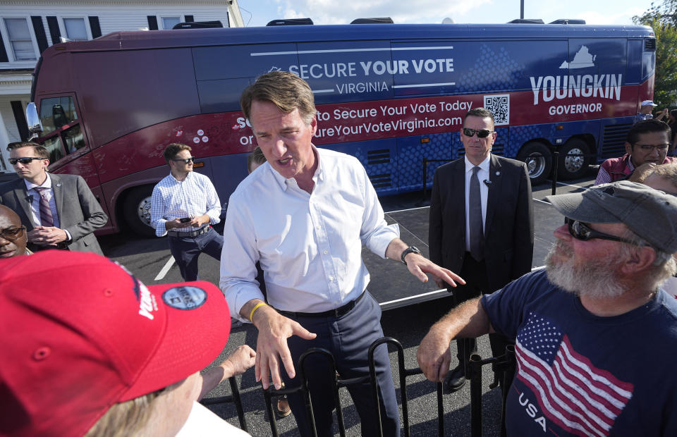 Virginia Gov. Glenn Youngkin gestures as he talks to supporters during an early voting rally Thursday Sep. 21, 2023, in Petersburg, Va. Every Virginia legislative seat will be on the ballot in the November election, and both parties see a possible path to a majority. (AP Photo/Steve Helber)