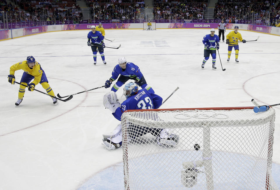 Sweden forward Loui Eriksson shoots and scores a goal against Slovenia goaltender Robert Kristan in the third period of a men's quarterfinal ice hockey game at the 2014 Winter Olympics, Wednesday, Feb. 19, 2014, in Sochi, Russia. (AP Photo/Mark Humphrey)