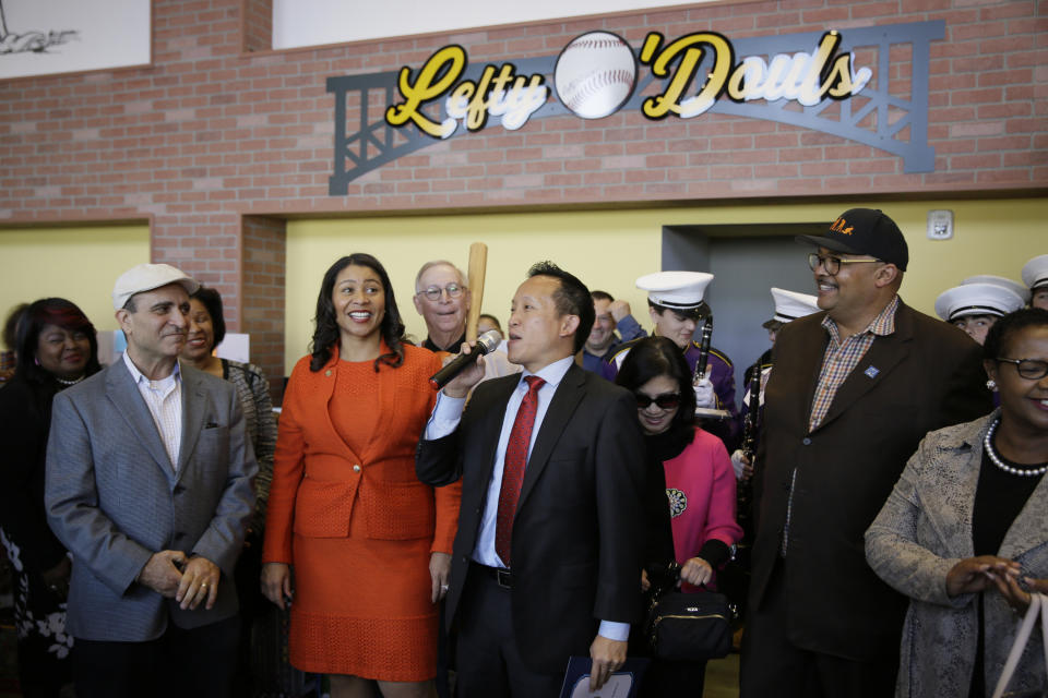 FILE - In this Nov. 20, 2018, file photo, from left, owner Nick Bovis, San Francisco Mayor London Breed, state assemblyman David Chiu speaking and city public works director Mohammed Nuru take part in the opening ceremonies of Lefty O'Doul's Baseball Ballpark Buffet & Café at Fisherman's Wharf in San Francisco. A top San Francisco official in charge of cleaning up the city's notoriously filthy streets and a champion of adding more portable toilets has been arrested, jail records show. Nuru was taken into custody Monday, Jan. 27, 2020, along with Bovis, the owner of Lefty O'Doul's, a longtime sports bar popular with tourists. Records say only that the men were arrested for felony safekeeping, which typically indicates federal charges. (AP Photo/Eric Risberg)