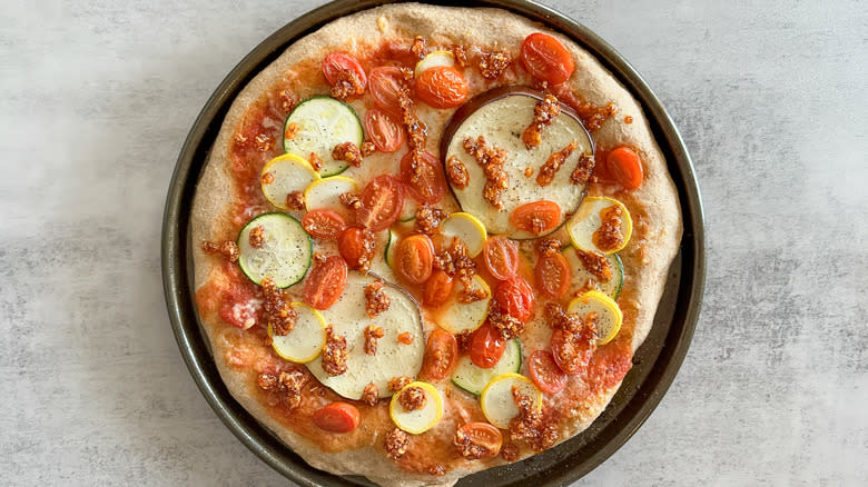 drizzled chili onion crisp on summer veggie pizza