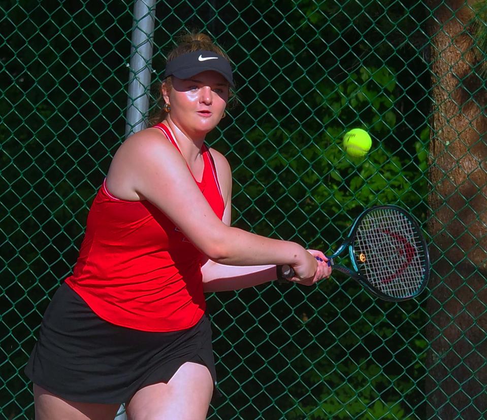 Marlena Colwell of Bridgewater/Raynham goes for a backhand in the tourney tennis doubles match against Taunton on Tuesday, May 30, 2023.