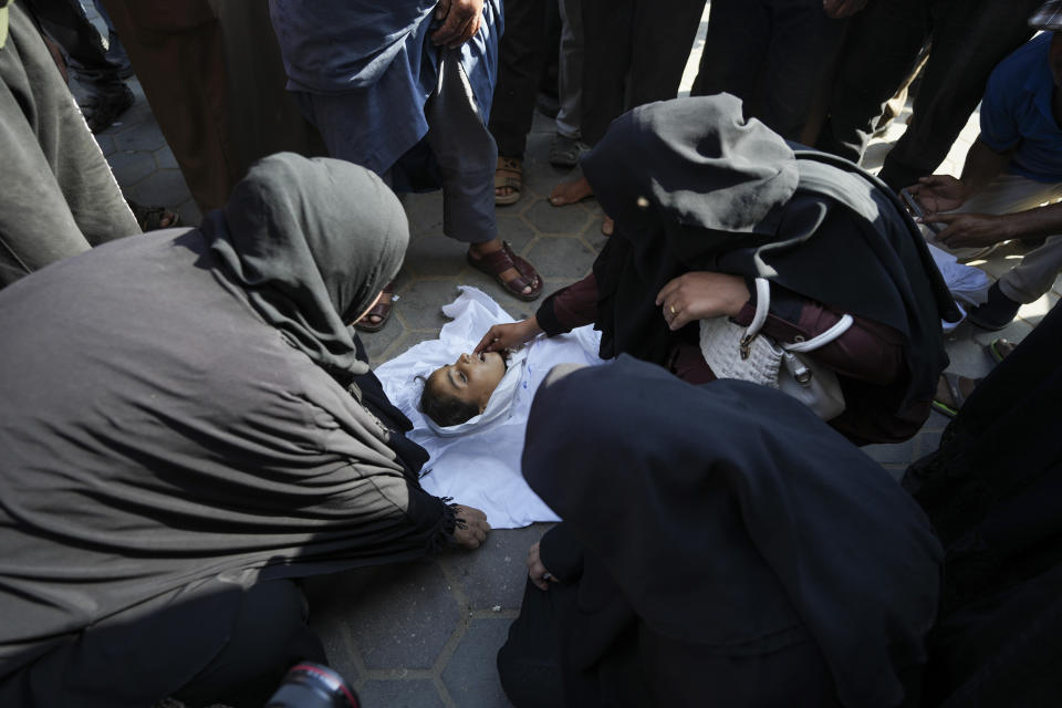 Palestinian women mourn a child killed in the Israeli bombardment of the Gaza Strip outside a hospital in Deir al Ballah on Wednesday, June 5, 2024. (AP Photo/Abdel Kareem Hana)