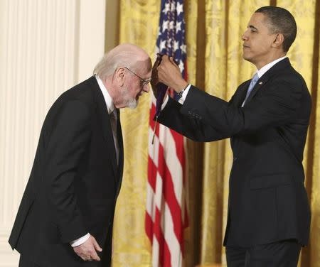U.S. President Barack Obama presents the 2009 National Medal of Arts to composer John Williams in the East Room of the White House in Washington, February 25, 2010. REUTERS/Larry Downing