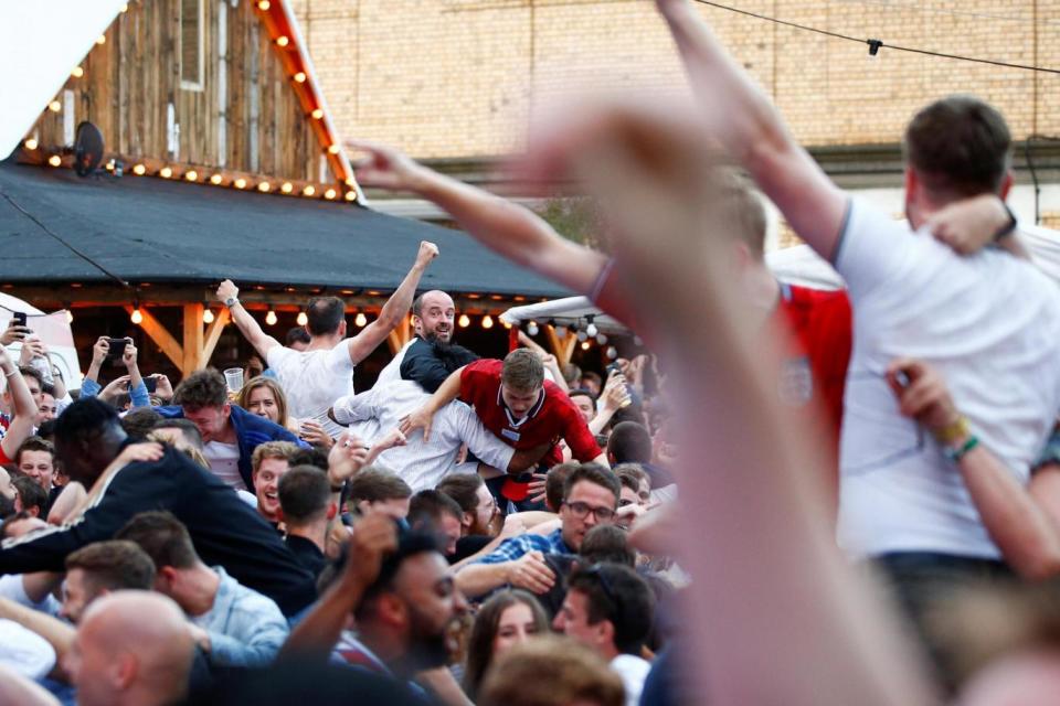 Supporters celebrate in frenzied scenes in the capital as Kane scores to seal victory (REUTERS)