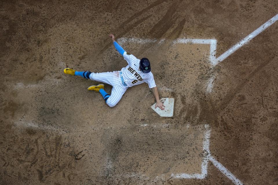 Milwaukee Brewers' Owen Miller scores during the eighth inning of a baseball game against the Pittsburgh Pirates Sunday, June 18, 2023, in Milwaukee. Miller scored on a hit by Luis Urias. (AP Photo/Morry Gash)