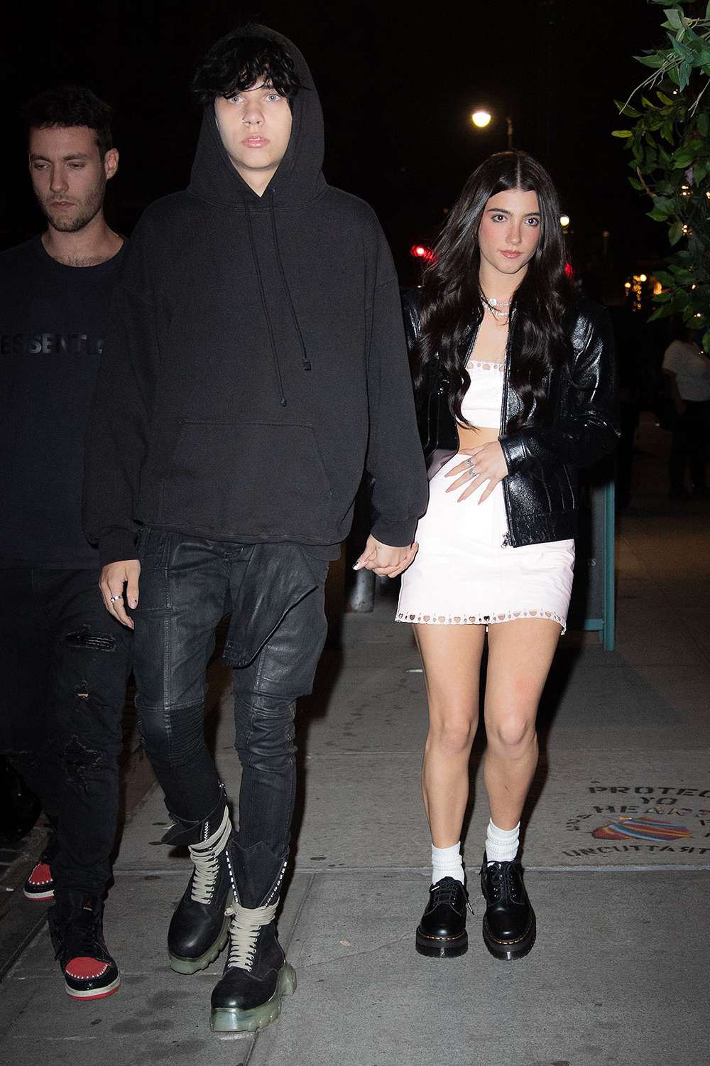 Landon Barker holds hands with rumored new girlfriend, TikTok star Charli D'Amelio as they leave Machine Dun Kelly's Madison Square Garden afterparty at Catch Steakhouse in New York.