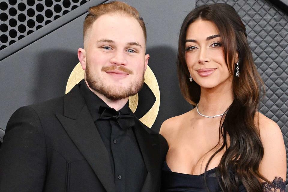 <p>Gilbert Flores/Billboard via Getty</p> Zach Bryan and Brianna LaPaglia at the Grammys in Los Angeles in February 2024