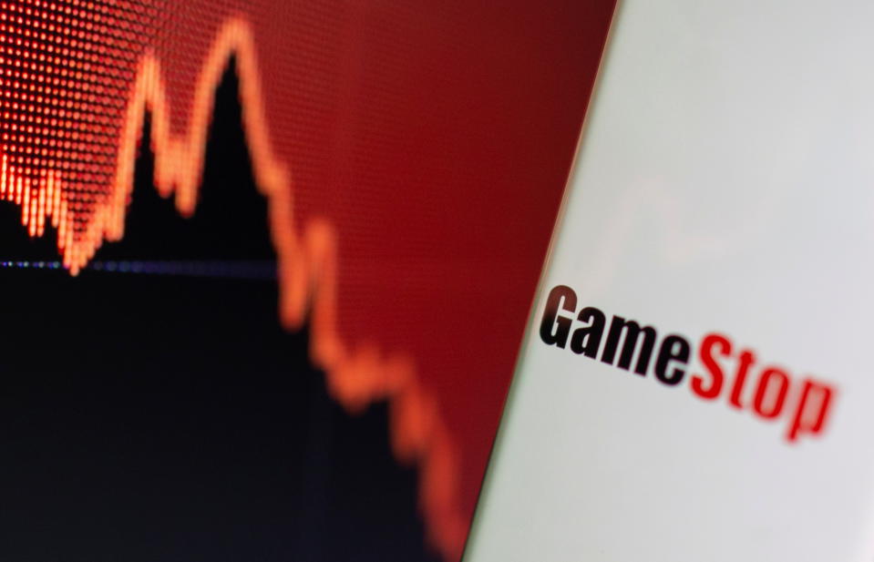 GameStop logo is seen near displayed stock graph in this illustration taken February 2, 2021. REUTERS/Dado Ruvic/Illustration
