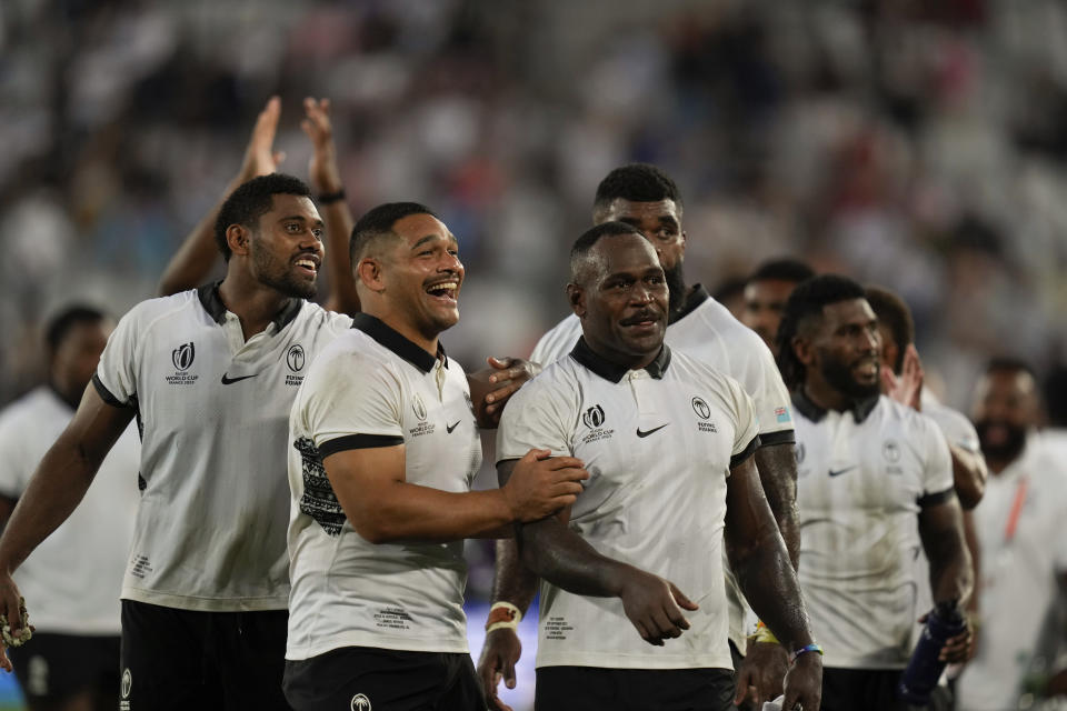 Fiji's Levani Botia, center right, celebrates with teammates at the end of the Rugby World Cup Pool C match between Fiji and Georgia at the Stade de Bordeaux in Bordeaux, France, Saturday, Sept. 30, 2023. (AP Photo/Thibault Camus)