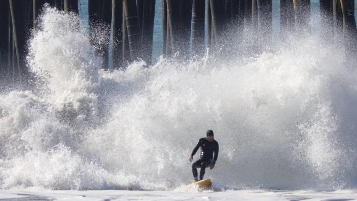 A high surf advisory was forecast by the National Weather Service with 12-foot sets. Meanwhile, surfers enjoyed the ride Jan. 24, 2022 in Cayucos.