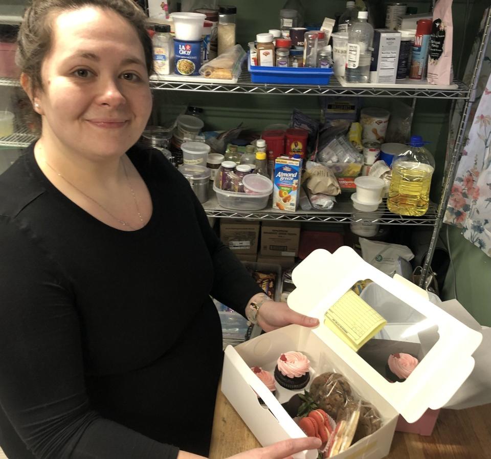 Casey Marsh, of Baked By CAM in Wells, Maine, is seen here in her kitchen on Tuesday, Feb. 13m 2024, with a box of sweets she baked and assembled for a client in time for Valentine's Day.