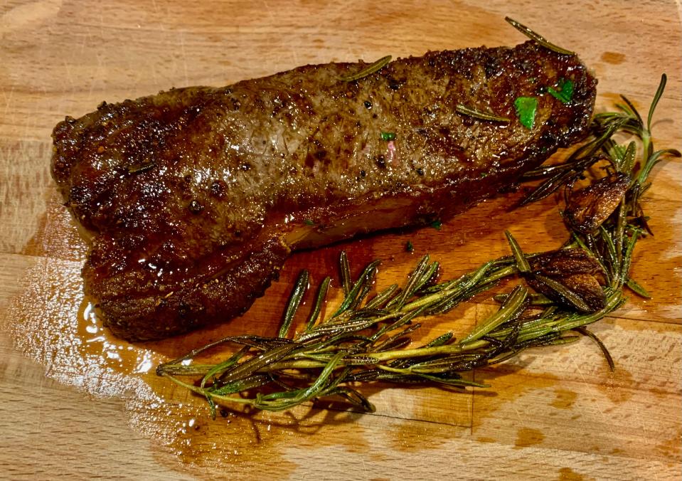 the final steak with an herb