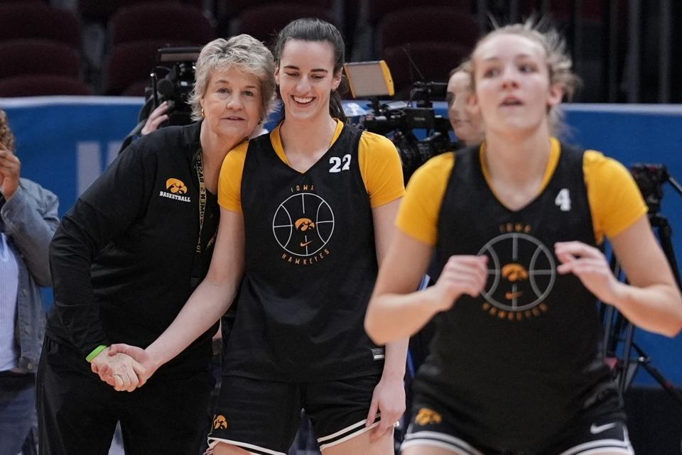 Iowa head coach Lisa Bluder talks to Caitlin Clark during a practice for an NCAA Women's Final Four semifinals basketball game Thursday, April 4, 2024, in Cleveland. (AP Photo/Morry Gash)
