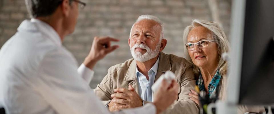 Senior couple having consultation with a doctor.