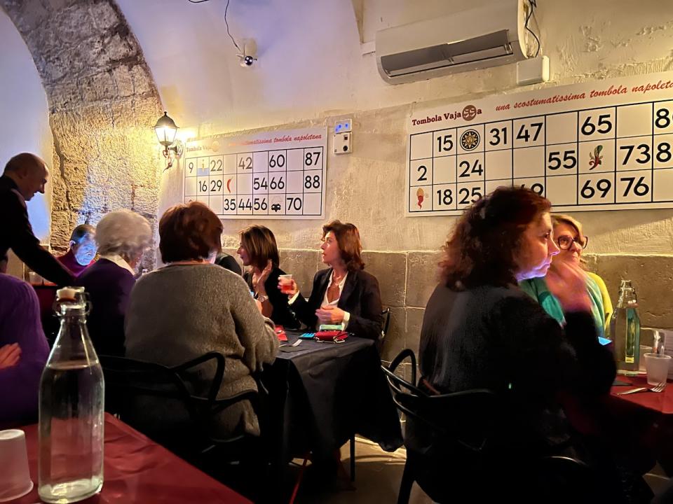 Patrons of Tombola Vajasso in Naples, Italy play a round of tombola.