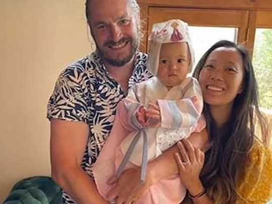 Jonathan Gerrish, Ellen Chung, their toddler, Miju.