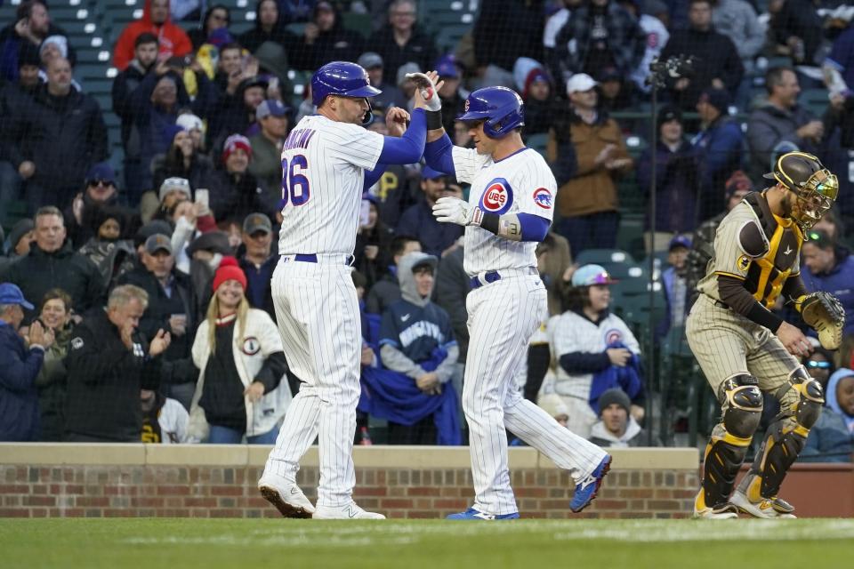 Chicago Cubs' Yan Gomes, right, and Trey Mancini celebrate Gomes' two-run home run against the San Diego Padres during the second inning of a baseball game Tuesday, April 25, 2023, in Chicago. (AP Photo/Erin Hooley)