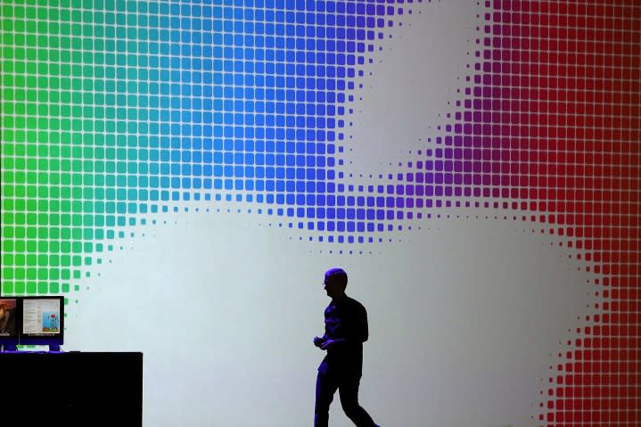 Apple CEO Tim Cook walks off stage after speaking during the Apple Worldwide Developers Conference.