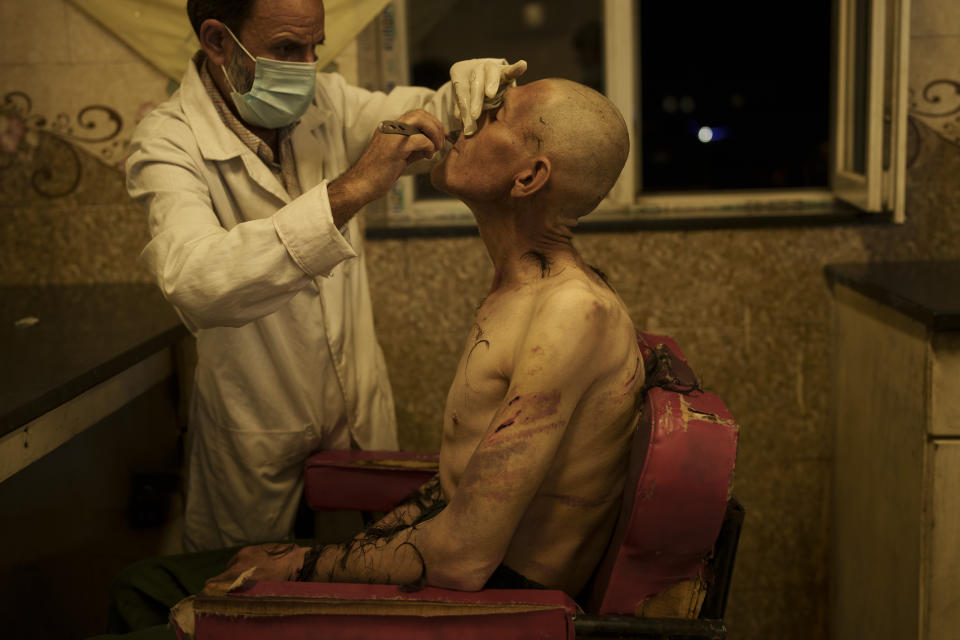 A drug user detained during a Taliban raid is shaved after arriving at Avicenna Medical Hospital for Drug Treatment in Kabul, Afghanistan, Saturday, Oct. 2, 2021.