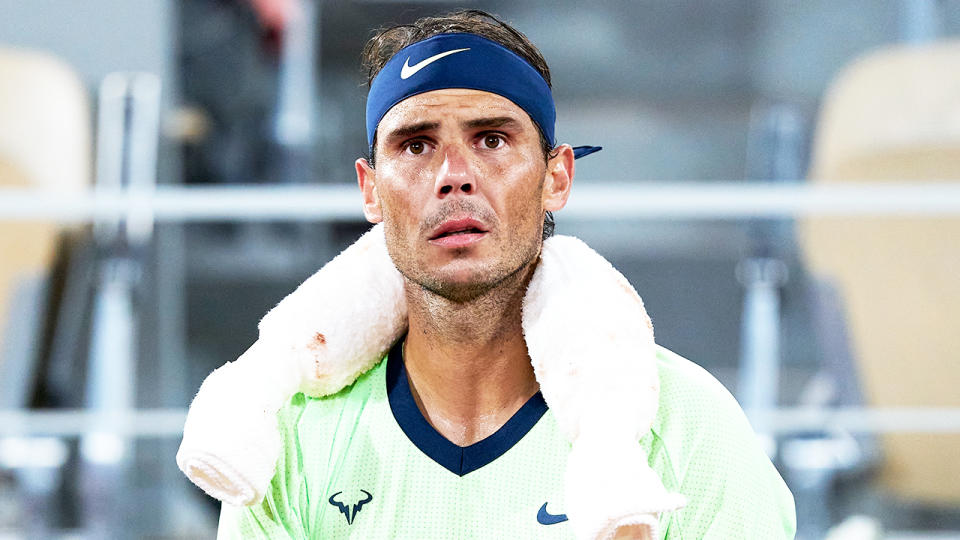 Rafael Nadal (pictured) looking worried during a tennis match against Novak Djokovic.
