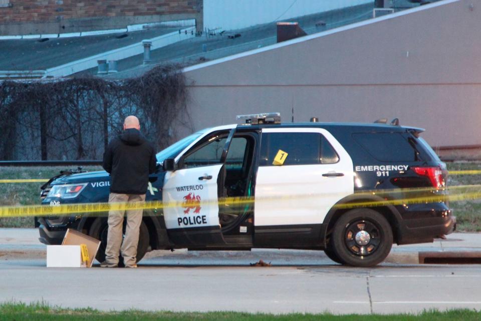 Authorities investigate the shooting of a man by a police officer following a report of a man with a gun at the foot of the Sixth Street Bridge in Waterloo on April 7, 2021. Marcelino Alvarez-Victoriano, who was paralyzed in the shooting, filed suit on Sept. 23, 2021, contending the shooting was not justified. Authorities say the officer shot Alvarez-Victoriano after he pointed a pellet gun that looked like a shotgun at two Black Hawk County sheriff's deputies.