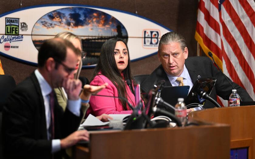 Huntington Beach, California October 17, 2023-Mayor Pro Tem Gracie Van Der Mark and mayor Tony Strickland listen to a speaker during a Huntington Beach City Council meeting Tuesday night. (Wally Skalij/Los Angeles Times)