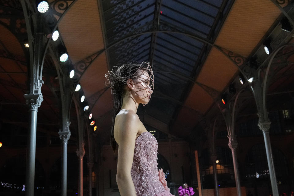 A model wears a creation for the Elie Saab Spring-Summer 2022 Haute Couture fashion collection, in Paris, Wednesday, Jan. 26, 2022. (AP Photo/Francois Mori)