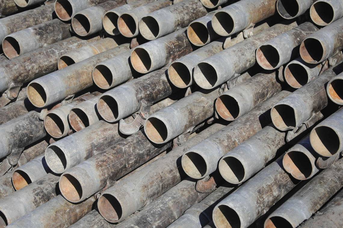 Irrigation pipes are stacked in a farm field near Highway 1 and Halcyon Road in Arroyo Grande on Dec. 4, 2023.