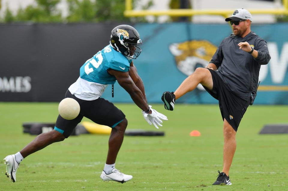 Jaguars WR (12) Jalen Camp blocks a ball during punt blocking drills during training camp at the practice fields outside TIAA Bank Field in Jacksonville, FL Tuesday, August 3, 2021. Tuesday was the first day of players wearing pads for practice.