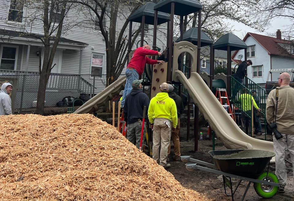 Working for Worcester volunteers help build a playground at Austin and Newbury streets.