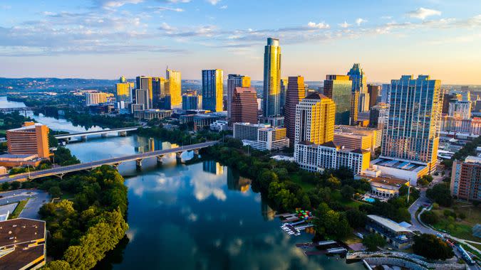 Austin Texas USA sunrise skyline cityscape over Town Lake or Lady Bird Lake with amazing reflection.