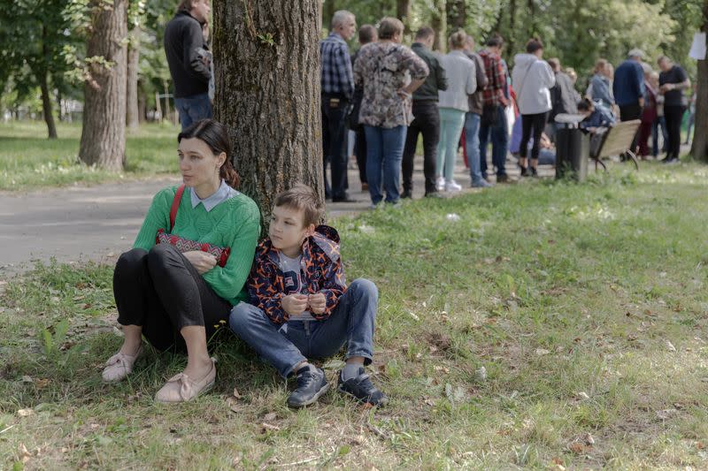 People gather outside a detention centre following recent protests against the presidential election results in Minsk