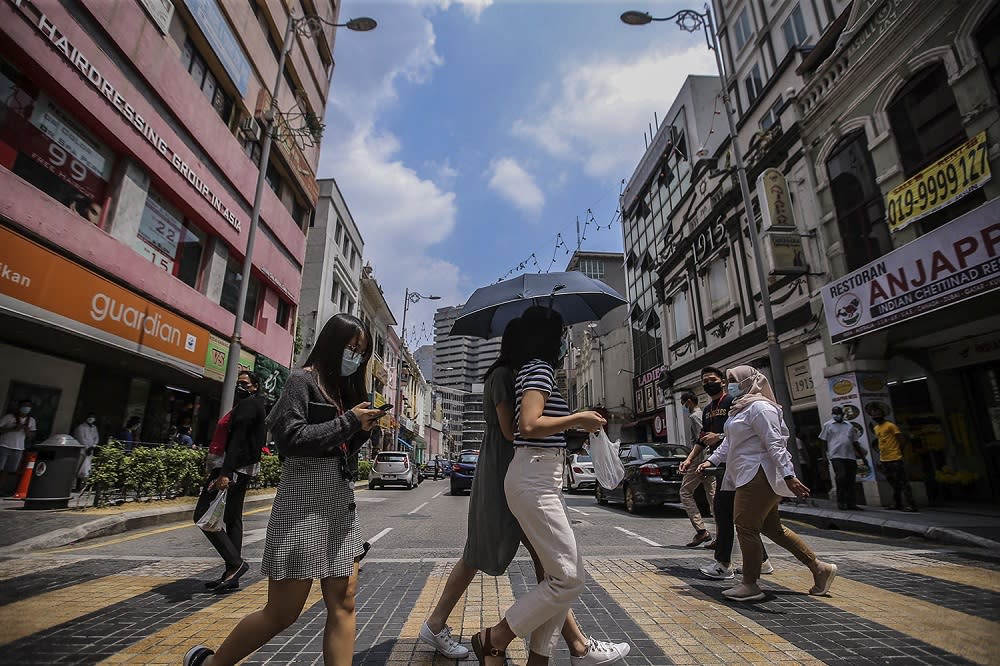 People were face masks during the movement control order, in Kuala Lumpur city centre February 16, 2021. — Picture by Hari Anggara