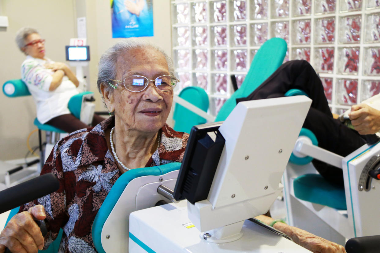 Lau Soon Siang, 97, works out on one of the six elderly-friendly machines used for a 12-week strength training programme called Gym Tonic. PHOTO: Wong Casandra/Yahoo News Singapore