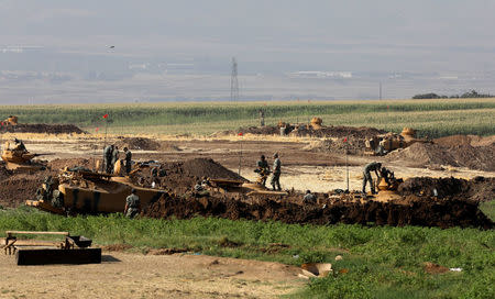 Turkish armoured military vehicles are seen during a military exercise near the Turkish-Iraqi border in Silopi, Turkey, September 22, 2017. REUTERS/Umit Bektas