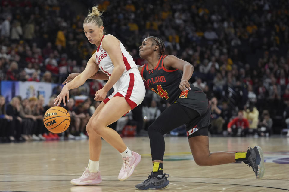 Nebraska guard Jaz Shelley, left, works toward the basket as Maryland guard Bri McDaniel defends during the second half of an NCAA college basketball game in the semifinals of the Big Ten women's tournament, Saturday, March 9, 2024, in Minneapolis. (AP Photo/Abbie Parr)