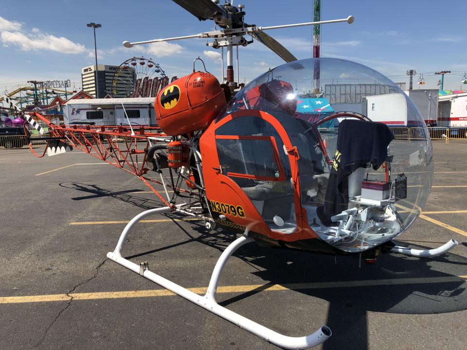 The restored version of the Batcopter from the 1960s <em>Batman</em> TV series is making daily flights at the State Fair Meadowlands. (Photo: Yahoo Entertainment/Ethan Alter)