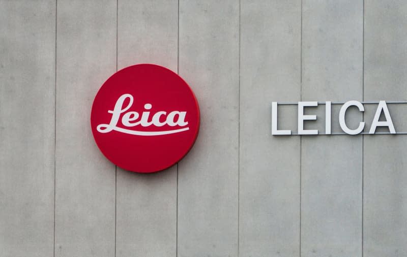The German company Leica Camera AG logo is attached to the exterior facade of its headquarters in Leitz-Park in Wetzlar. German camera and optics manufacturer Leica reported on 20 February that its annual turnover hit a record level for the third time in a row. Andreas Arnold/dpa