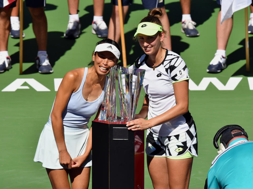 INDIAN WELLS, CA - OCTOBER 16: BNP Paribas Open doubles champions Su-Wei Hsieh of Chinese Taipei and Elise Mertens of Belgium pose for photographs with the championship trophy on center court after a doubles finals match played on October 16, 2021 at the Indian Wells Tennis Garden in Indian Wells, CA. (Photo by John Cordes/Icon Sportswire via Getty Images)