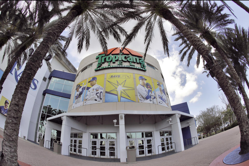 In this image taken with a fisheye lens, Tropicana Field, the home of the Tampa Bay Rays, is deserted Thursday, March 26, 2020, in St. Petersburg, Fla. Major League Baseball's regular season has been delayed in an attempt to help stop the spread of the coronavirus. The Rays were scheduled to open the season against the Pittsburgh Pirates. (AP Photo/Chris O'Meara)