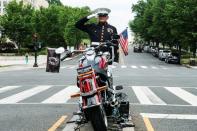 Marine SSGT Tim Chambers renders a salute paying respect for U.S. veterans on Memorial Day holiday in Washington