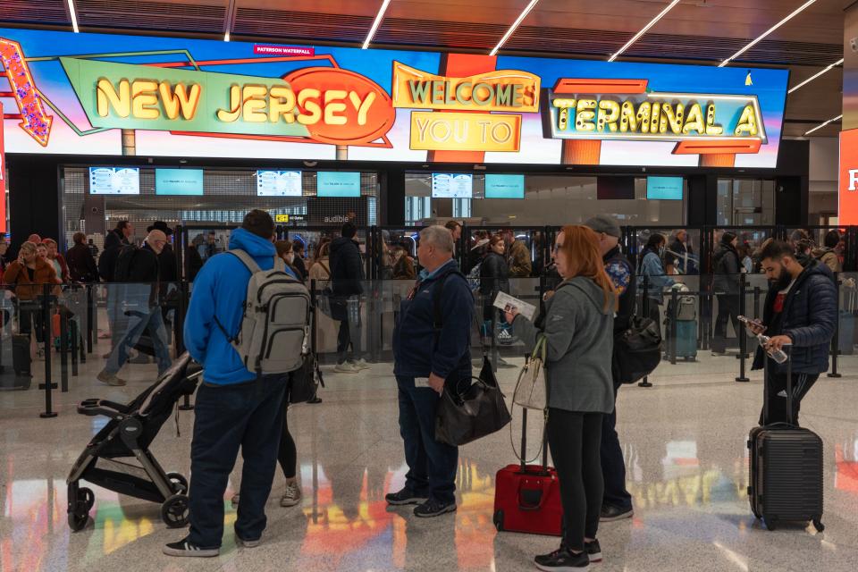 Travelers waiting in line to go through the security check point. After several delays, the new Terminal A is open to travelers at Newark Liberty Airport on Thursday Jan. 12, 2023. 