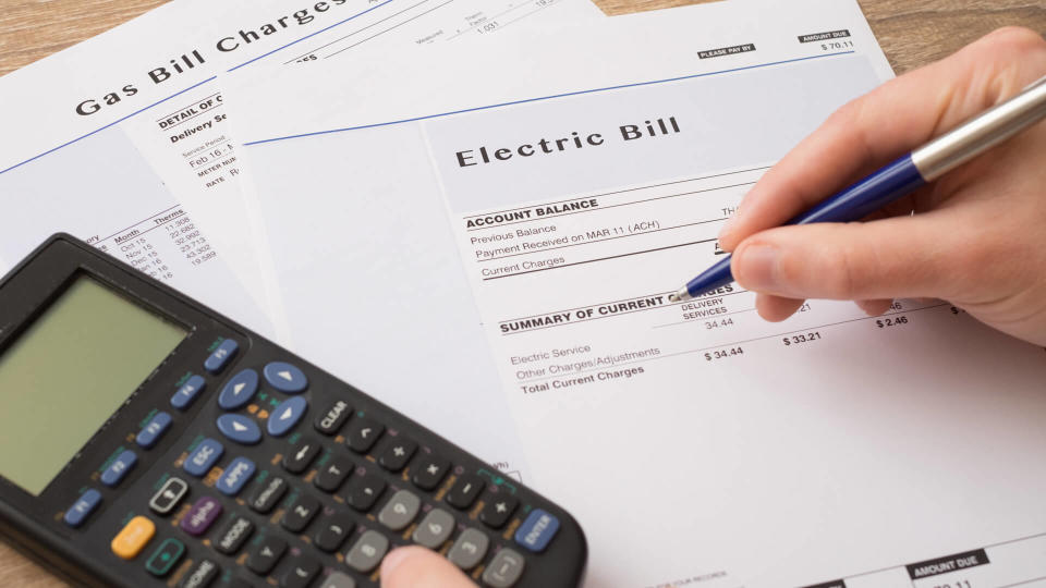 Electric bill charges paper form on the table.