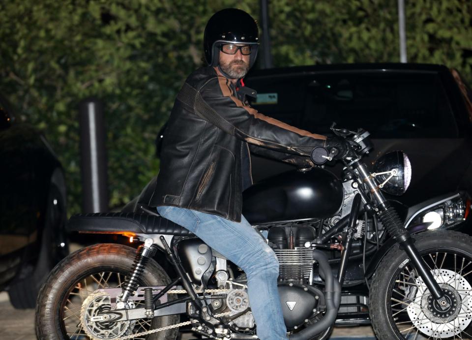 Gerard Butler takes off on his motorcycle after dining at Nobu Malibu with friends