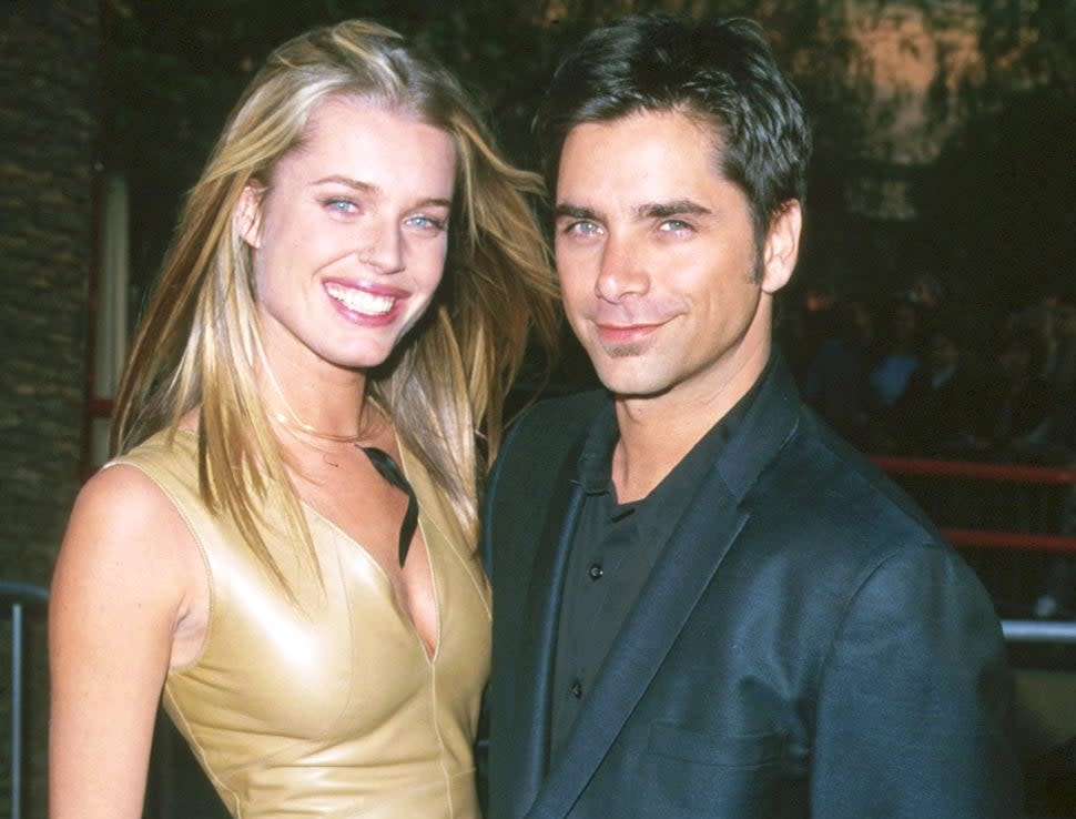 John Stamos and Rebecca Romijn