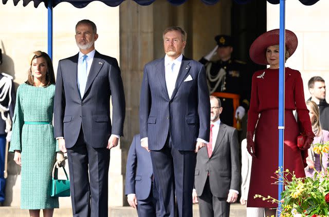 <p>Carlos Alvarez/Getty</p> (Left to right) Queen Letizia of Spain and King Felipe of Spain stand alongside King Willem-Alexander and Queen Maxima of the Netherlands during the welcome ceremony of the Spanish state visit on April 17, 2024, in Amsterdam.